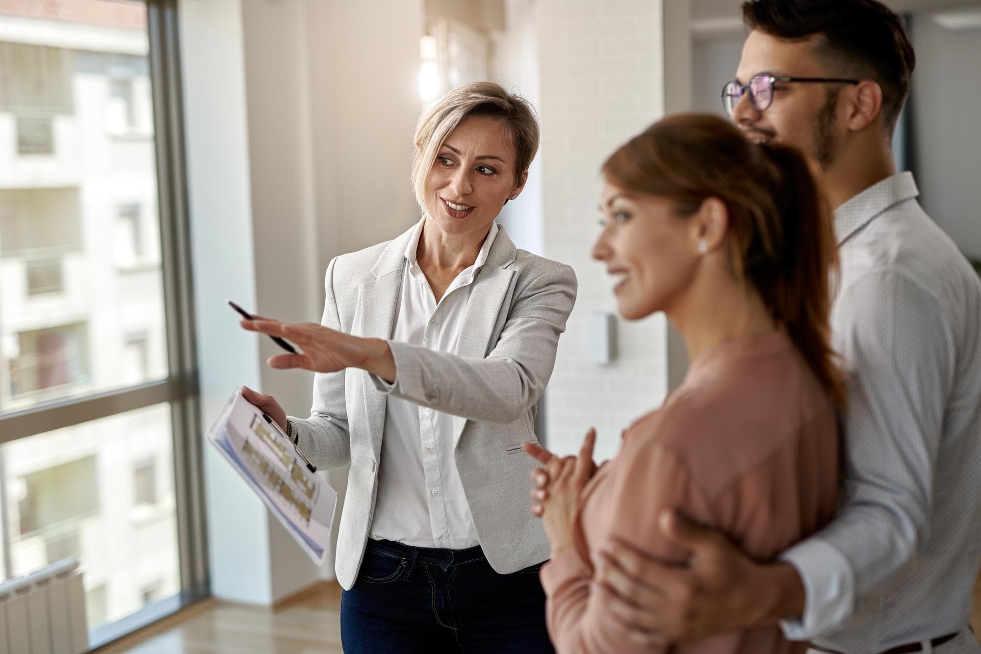 Agent and sellers reviewing home updates